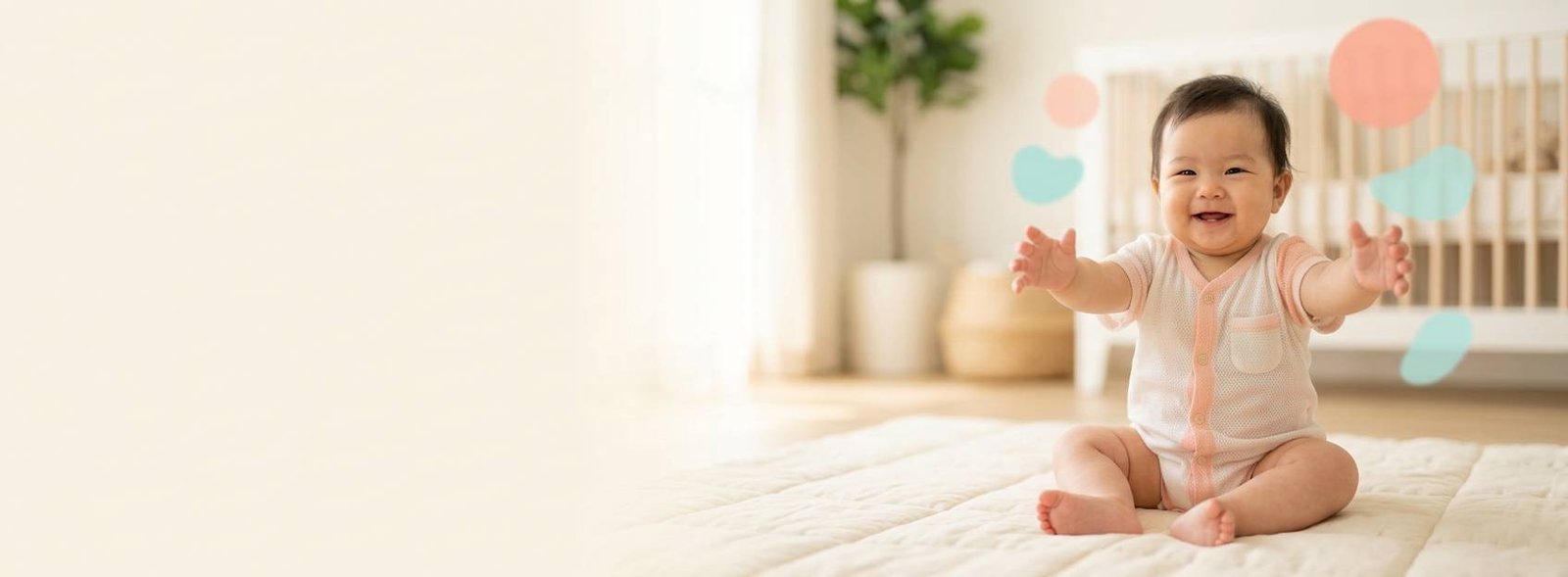Smiling baby in a breathable mesh romper sitting on a play mat